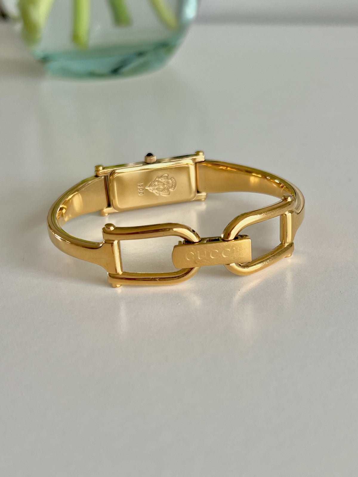 Gucci 1500 Gold Bangle Women’s Watch Mother of Pearl Dial, case profile of a vintage women's watch at Gilded Hour.