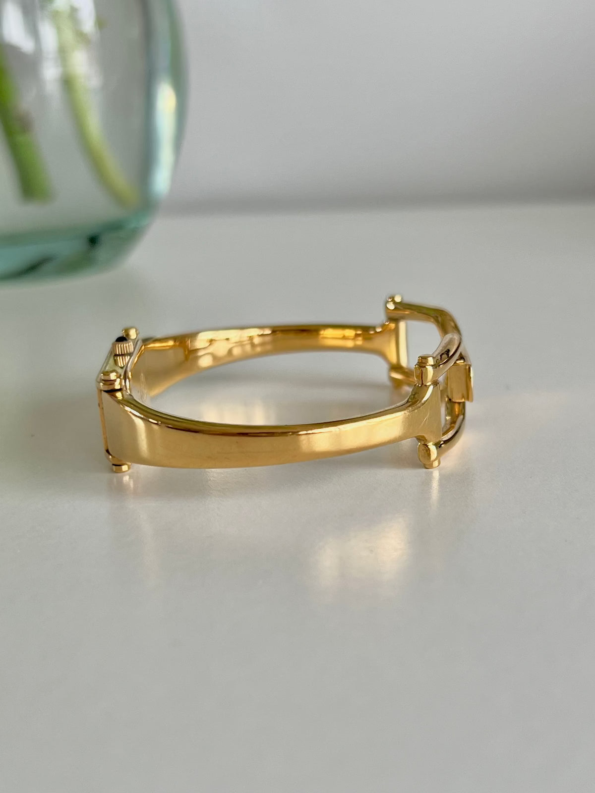 Gucci 1500 Gold Bangle Women’s Watch Mother of Pearl Dial, bracelet detail of a vintage women's watch at Gilded Hour.
