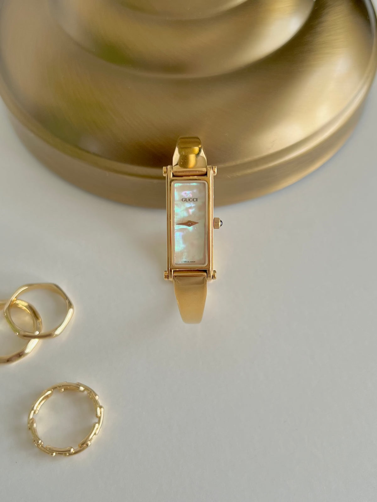 Gucci 1500 Gold Bangle Women’s Watch Mother of Pearl Dial, box set of a vintage women's watch at Gilded Hour.