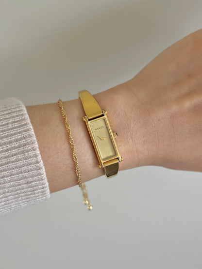 Gucci 1500 Gold Bangle Women’s Watch Champagne Dial