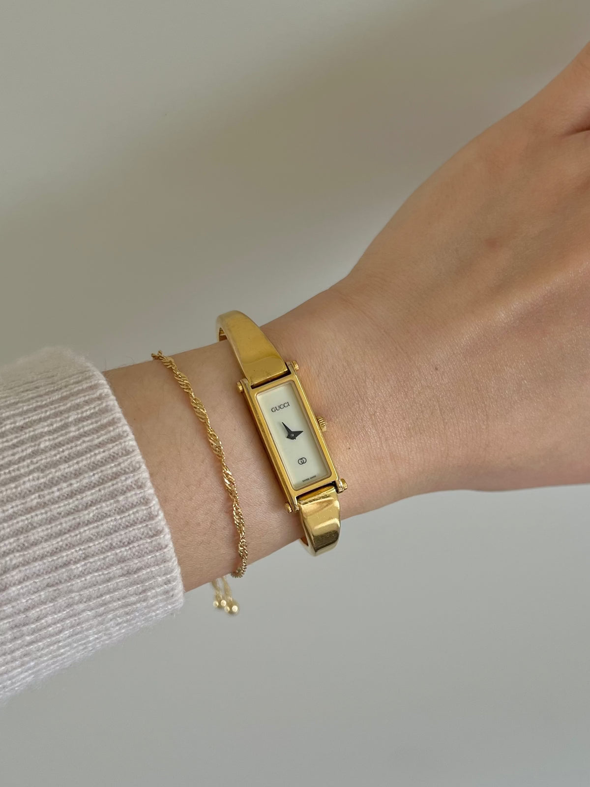 Gucci 1500 Gold Bangle Women’s Watch Ivory Dial, dial close up of a vintage women's watch at Gilded Hour.