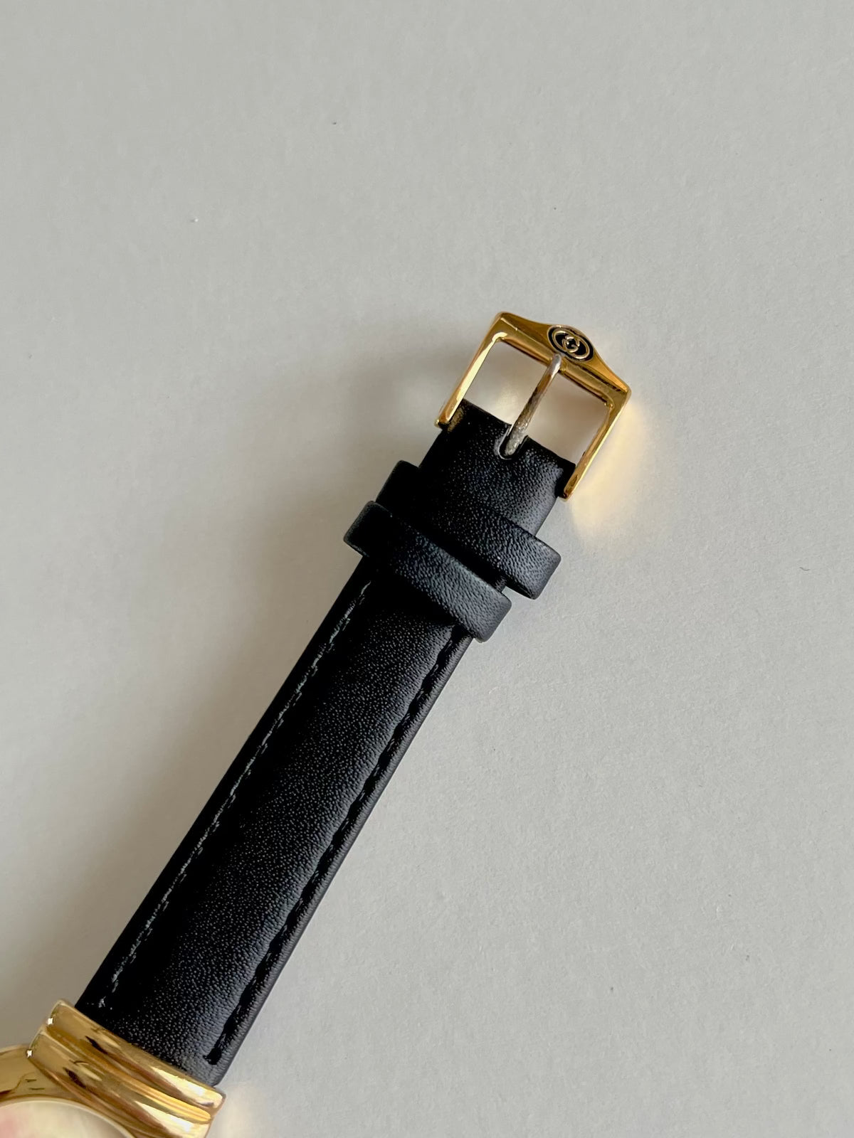 Gucci 5300M Gold Unisex Watch Mother of Pearl Dial, wrist shot of a vintage women's watch at Gilded Hour.