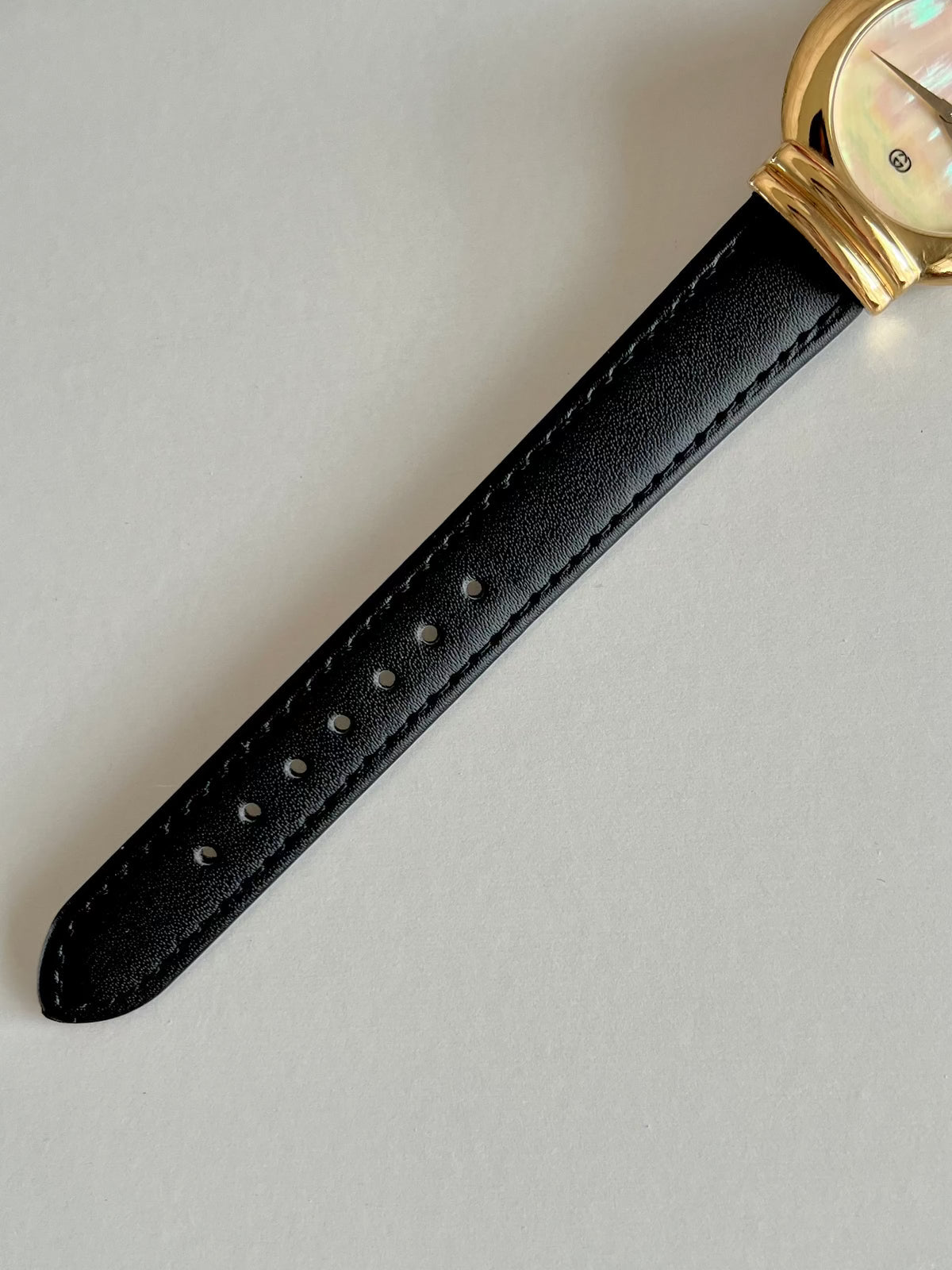 Gucci 5300M Gold Unisex Watch Mother of Pearl Dial, case profile of a vintage women's watch at Gilded Hour.