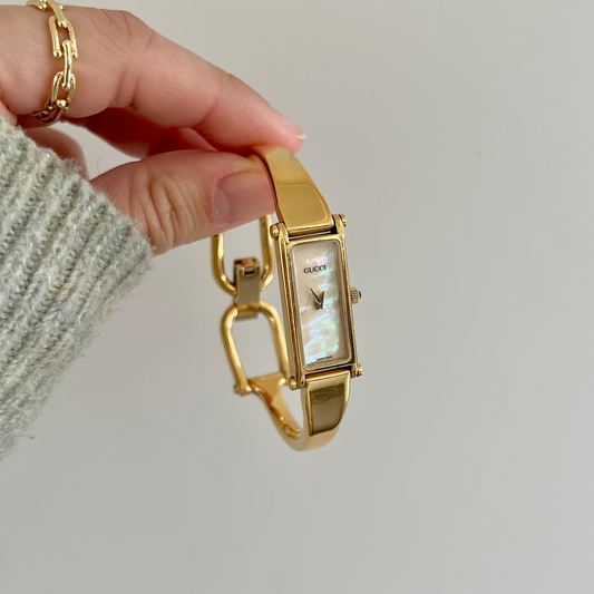 Gucci 1500 Gold Bangle Women’s Watch Mother of Pearl Dial
