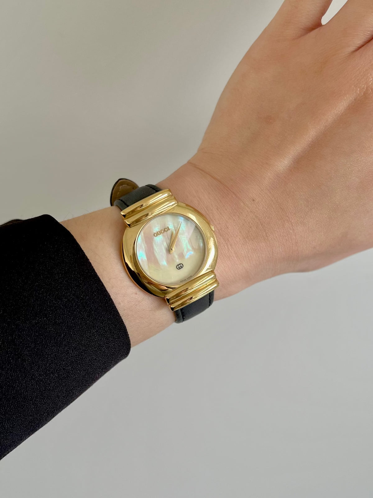 Gucci 5300M Gold Unisex Watch Mother of Pearl Dial, angled view of a vintage women's watch at Gilded Hour.