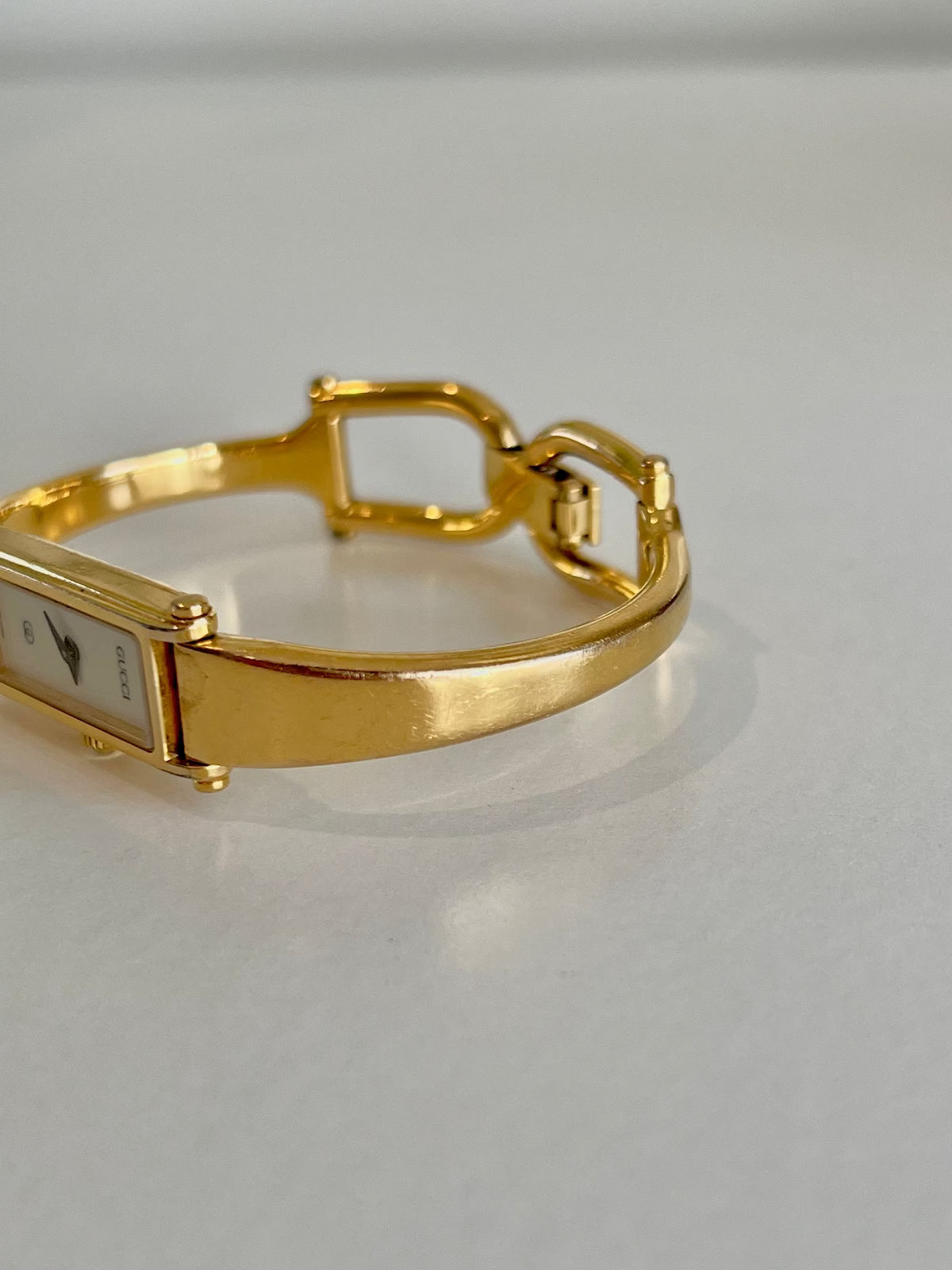 Gucci 1500 Gold Bangle Women’s Watch Ivory Dial, caseback detail of a vintage women's watch at Gilded Hour.