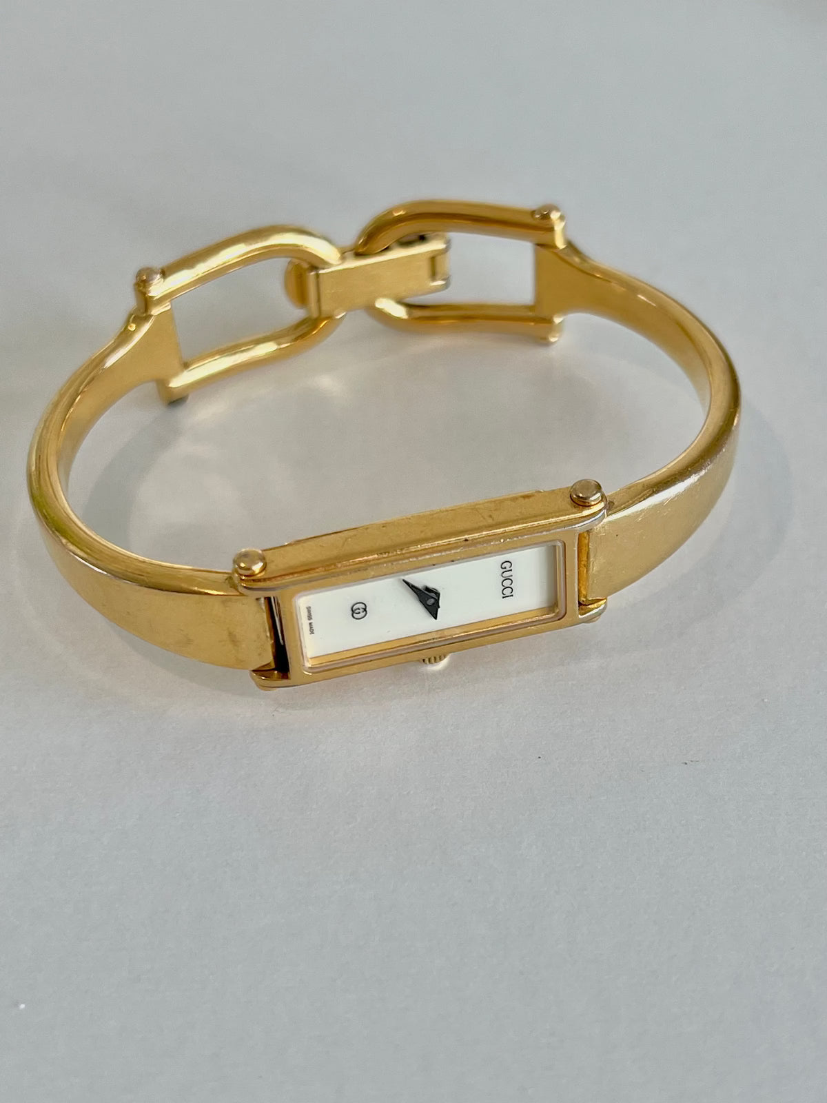 Gucci 1500 Gold Bangle Women’s Watch Ivory Dial, front view of a vintage women's watch at Gilded Hour.