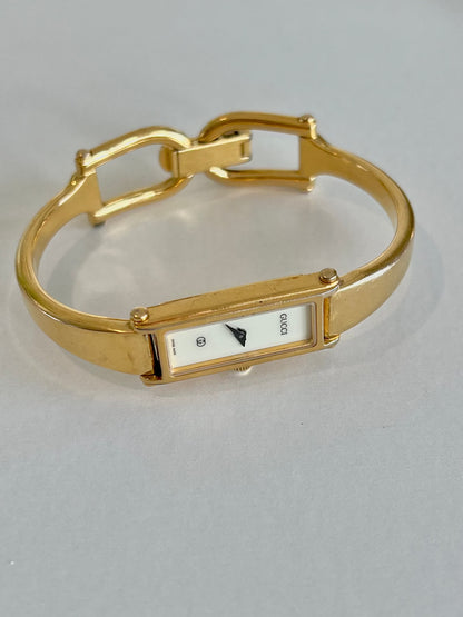 Gucci 1500 Gold Bangle Women’s Watch Ivory Dial, front view of a vintage women's watch at Gilded Hour.