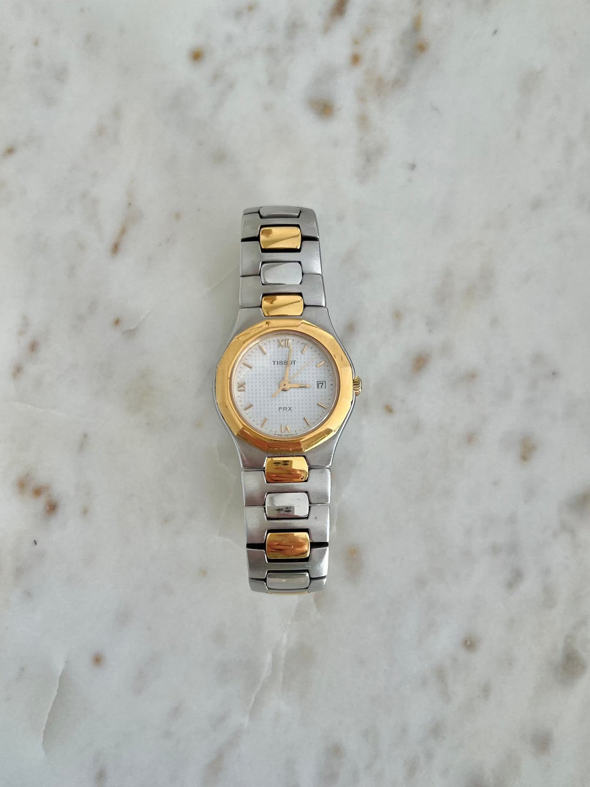 Tissot P440 White Roman Date Two Tone Watch: straight view of full bracelet.