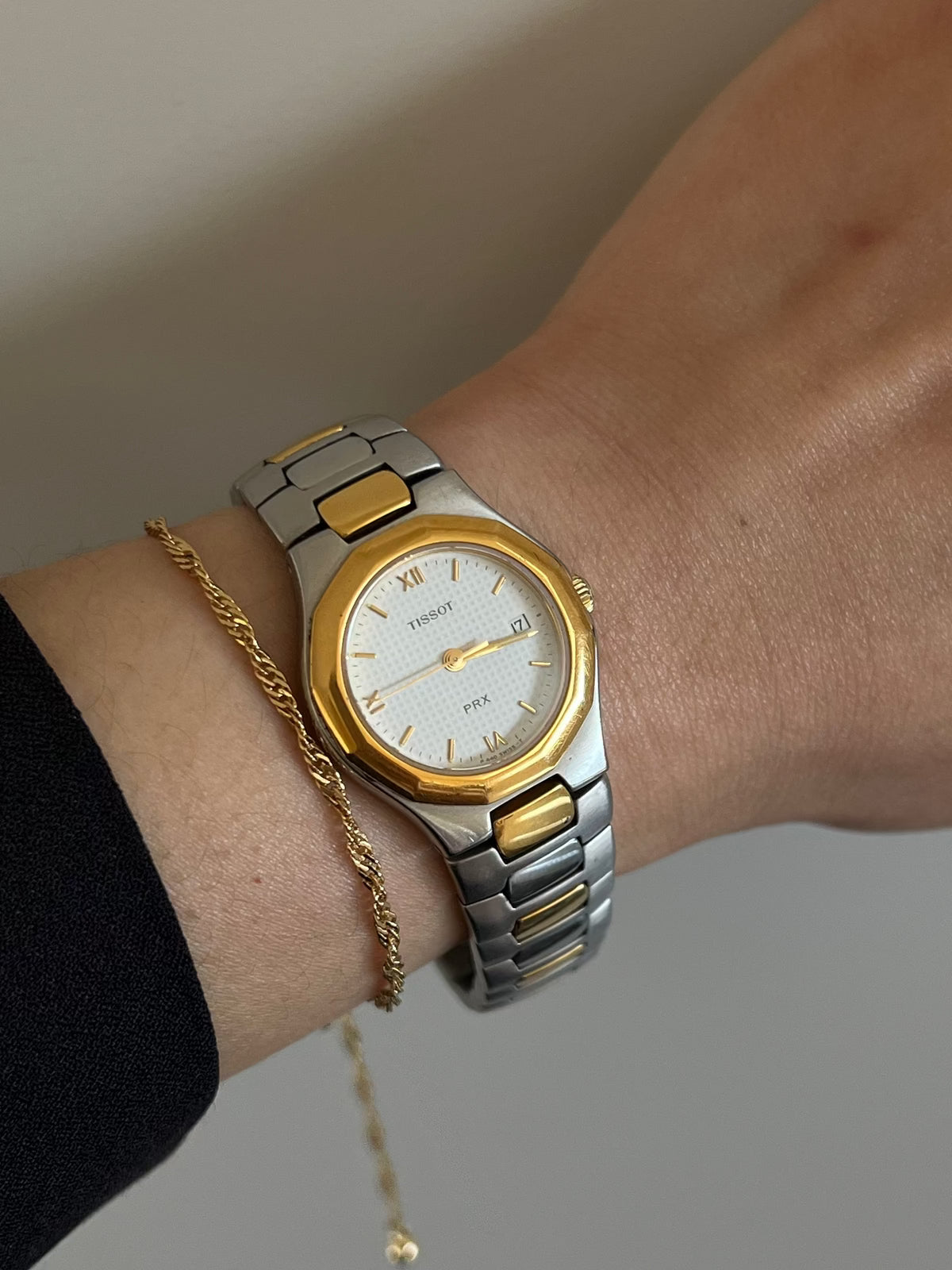 Tissot P440 White Roman Date Two Tone Watch: alternate wrist view of dial and bracelet.
