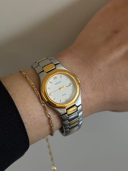 Tissot P440 White Roman Date Two Tone Watch: alternate wrist view of dial and bracelet.