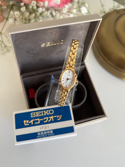 Seiko Tisse Gold Bead Bracelet Women's Watch with Encrusted Ruby & Diamond, dial close up of a vintage women's watch at Gilded Hour.