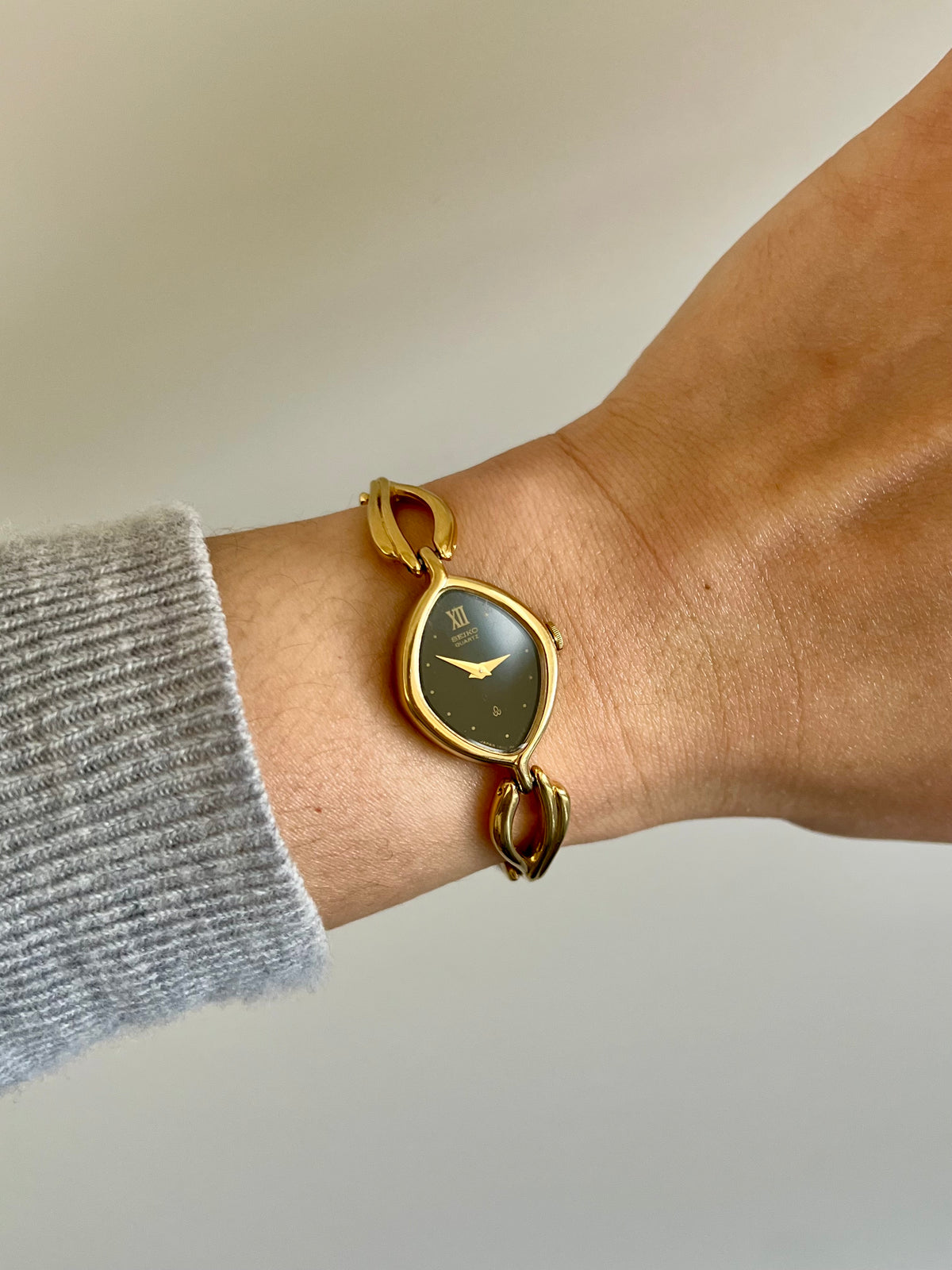 Seiko Black Dial Leaf Bracelet Women’s Watch, angled view of a vintage women's watch at Gilded Hour.