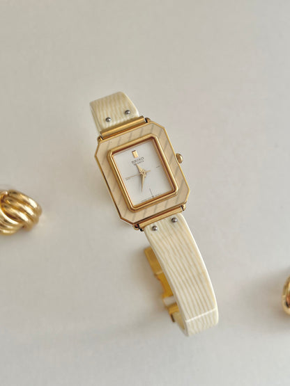 Seiko Rectangular Golden Bangle Women's Watch with Enamel Bezel