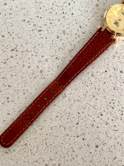 Burberrys Gold Lady Watch with Sculpted Loop Lugs and Champagne Dial 24mm Diameter