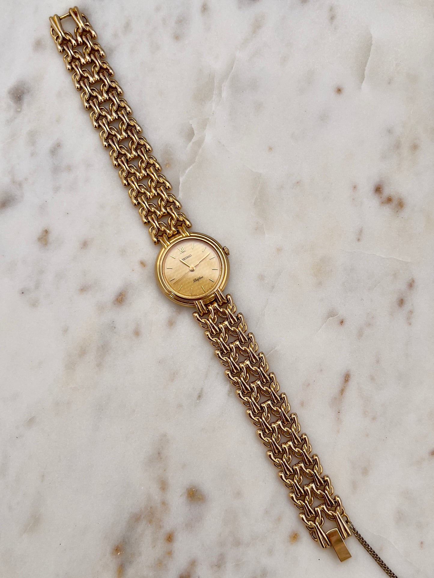 Seiko Belfina Gold Toned Watch with Intricate Bracelet