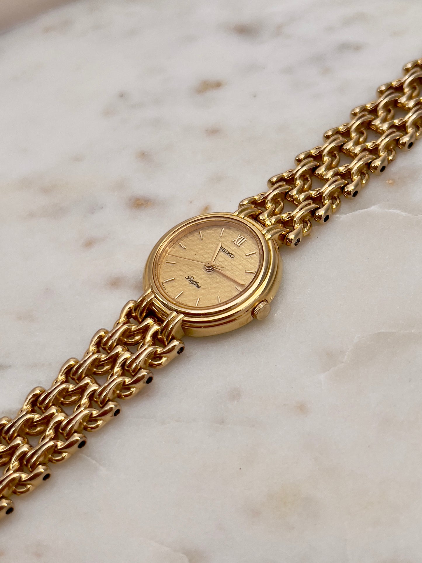 Seiko Belfina Gold Toned Watch with Intricate Bracelet
