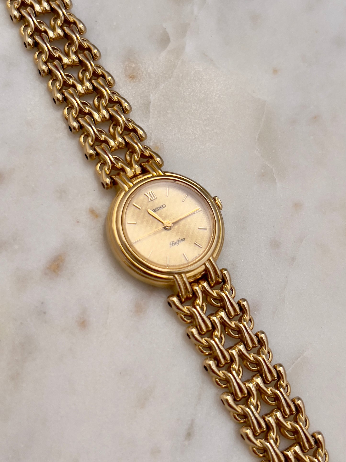 Seiko Belfina Gold Toned Watch with Intricate Bracelet