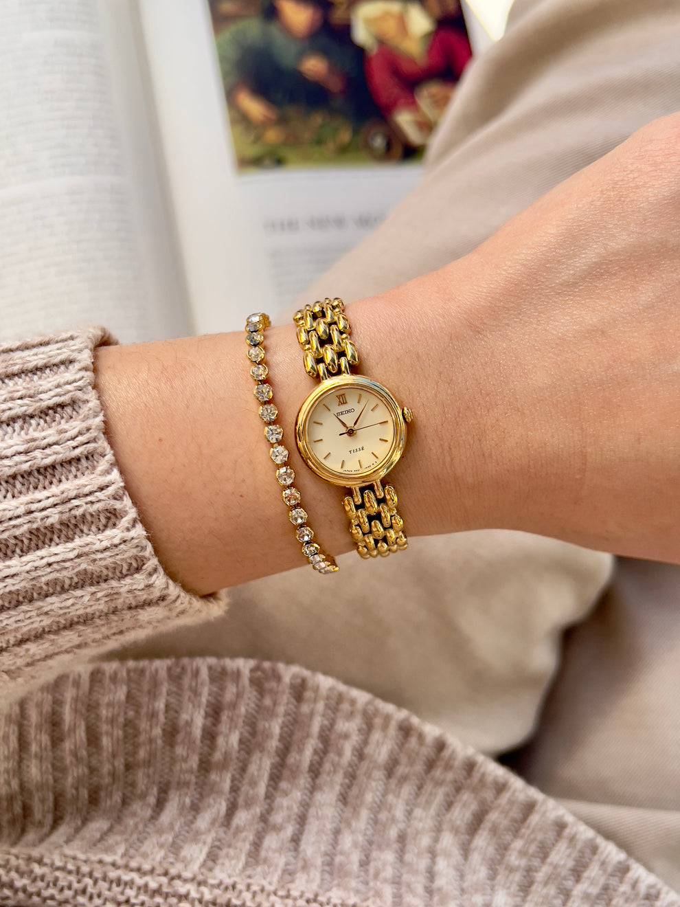 Round gold toned Seiko Tisse with ivory dial and rice style bracelet