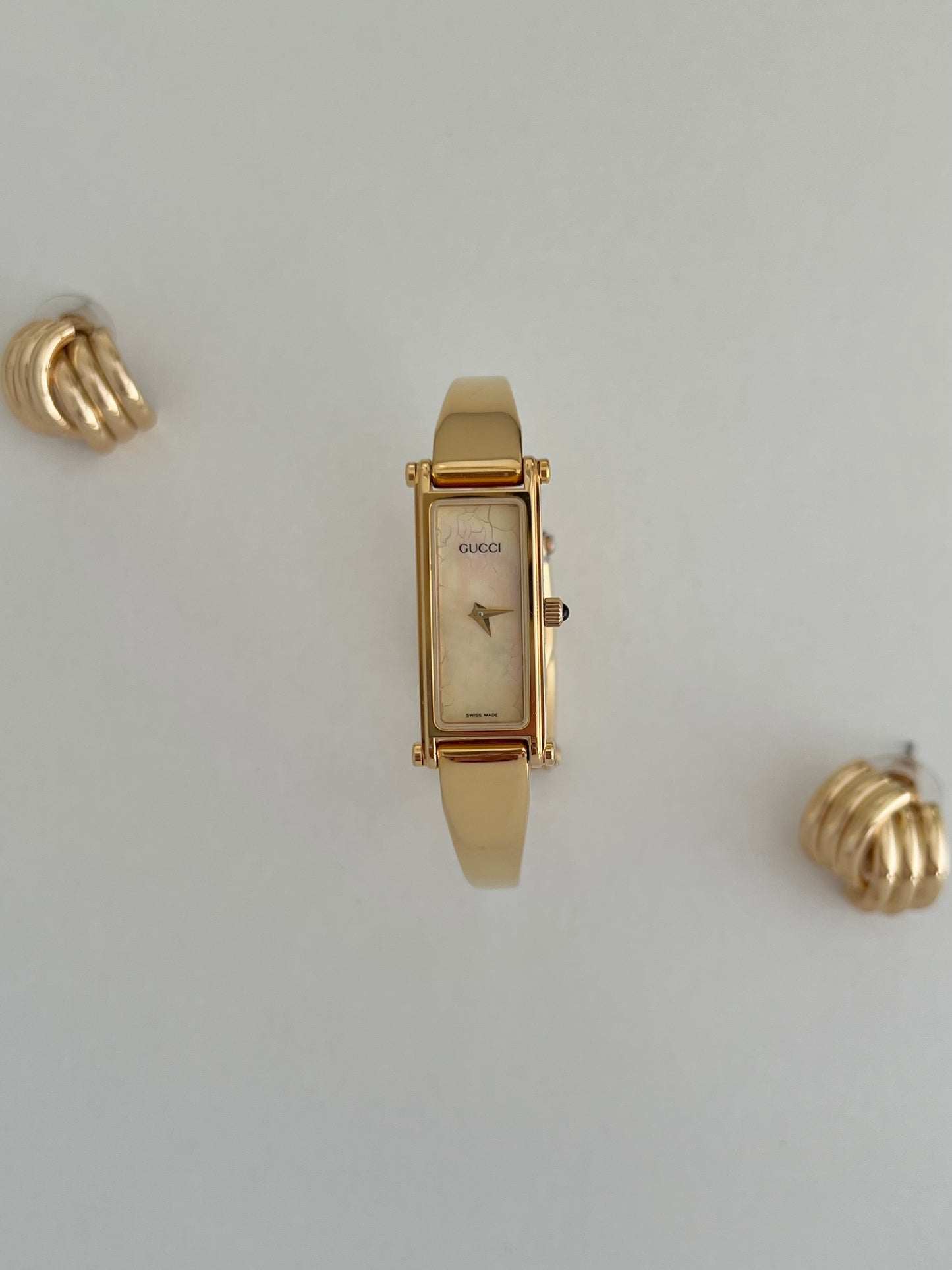 Gucci 1500 Gold Bangle Women’s Watch Mother of Pearl Dial