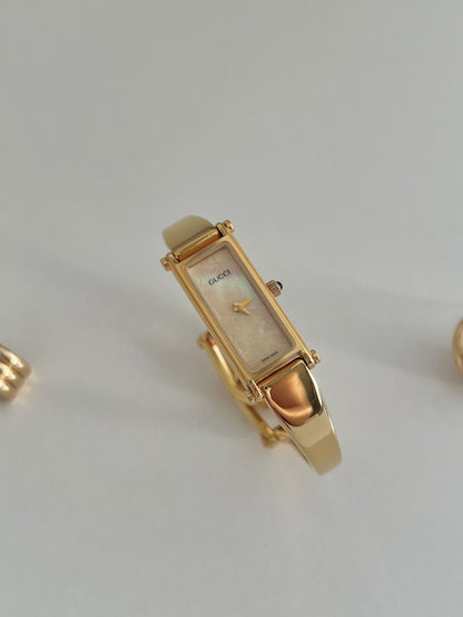 Gucci 1500 Gold Bangle Women’s Watch Mother of Pearl Dial