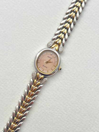 Seiko Exceline Ladies Oval Watch with Stardust Salmon Dial and Diamond Leaf Bracelet