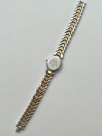 Seiko Exceline Ladies Oval Watch with Stardust Salmon Dial and Diamond Leaf Bracelet