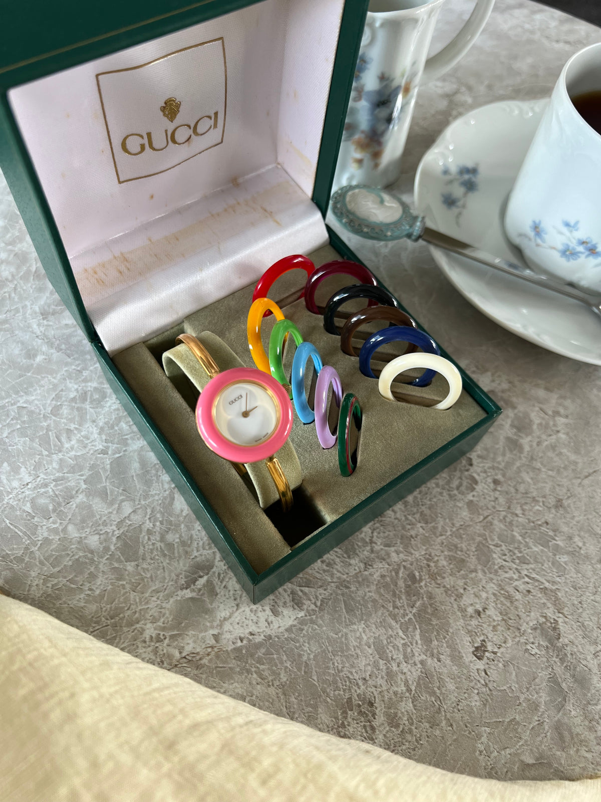 Gucci 1100L Interchangeable Bezel Women’s Watch Full Set of 12 - 2, angled view of a vintage women's watch at Gilded Hour.