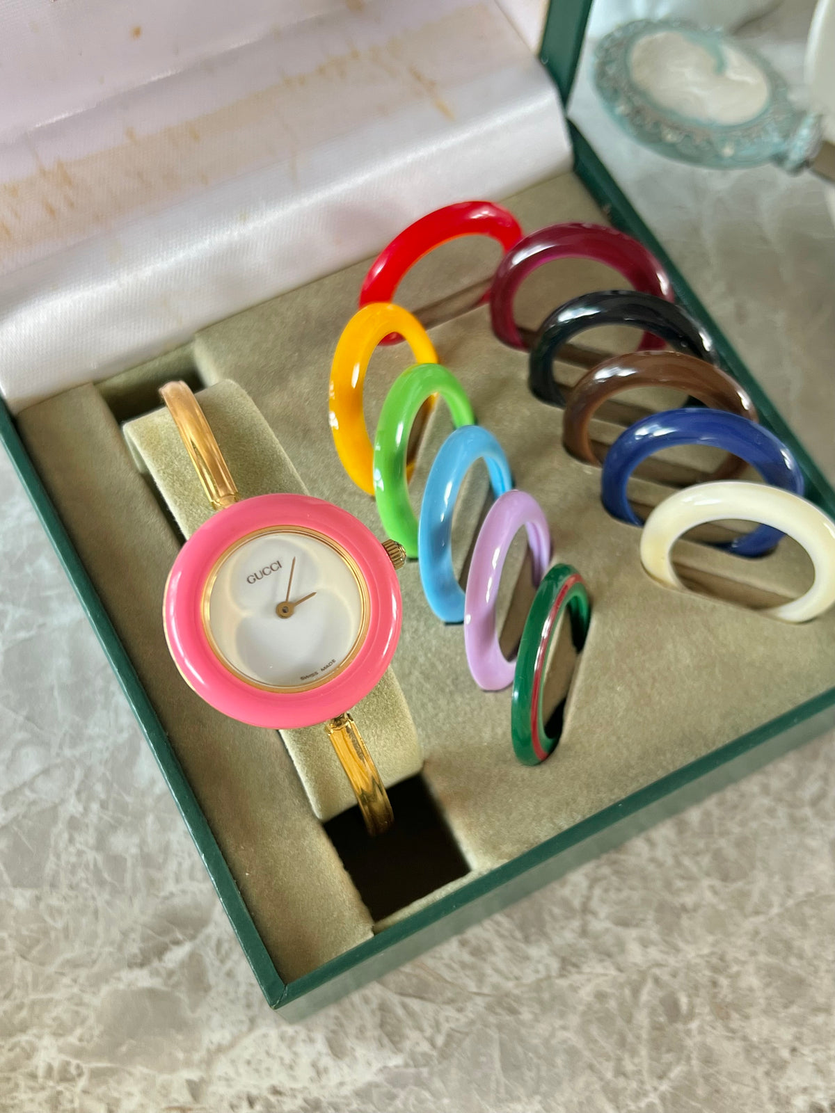 Gucci 1100L Interchangeable Bezel Women’s Watch Full Set of 12 - 2, front view of a vintage women's watch at Gilded Hour.