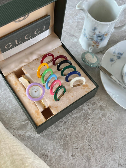 Gucci 1100L Interchangeable Bezel Women’s Watch Full Set of 12, angled view of a vintage women's watch at Gilded Hour.