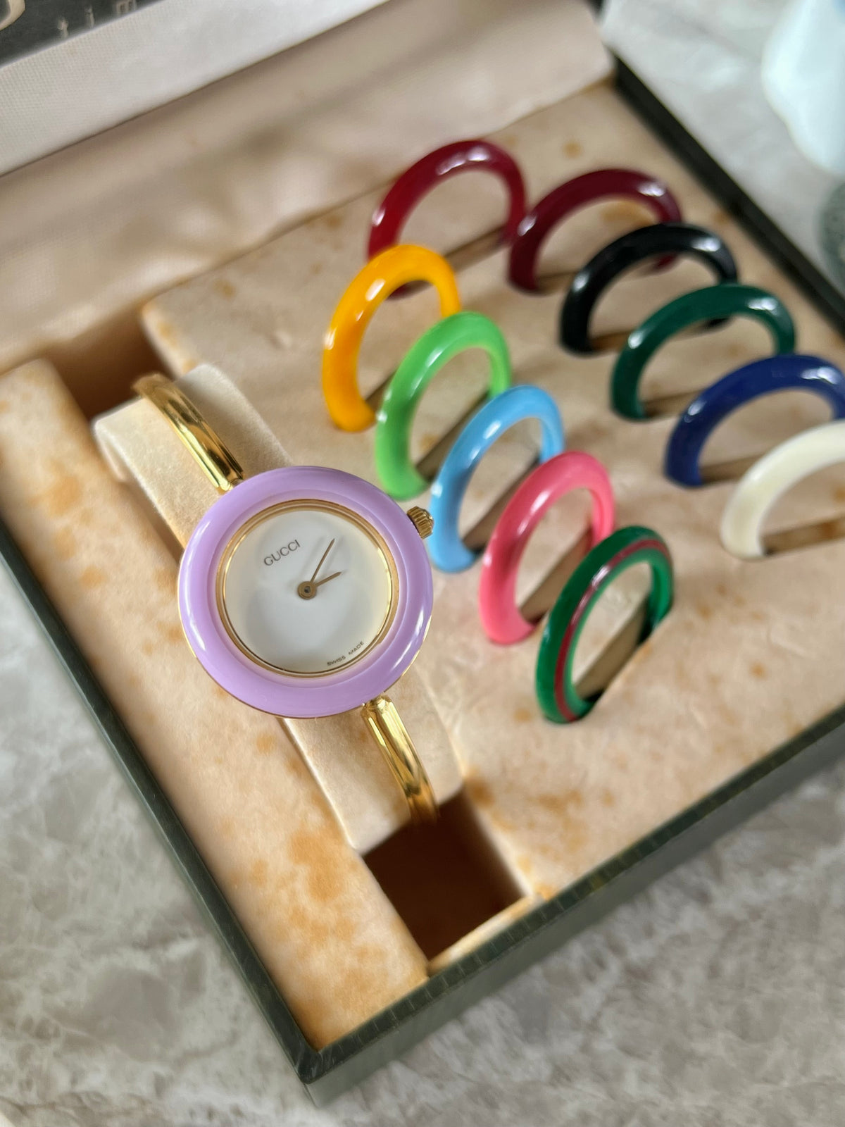 Gucci 1100L Interchangeable Bezel Women’s Watch Full Set of 12, front view of a vintage women's watch at Gilded Hour.