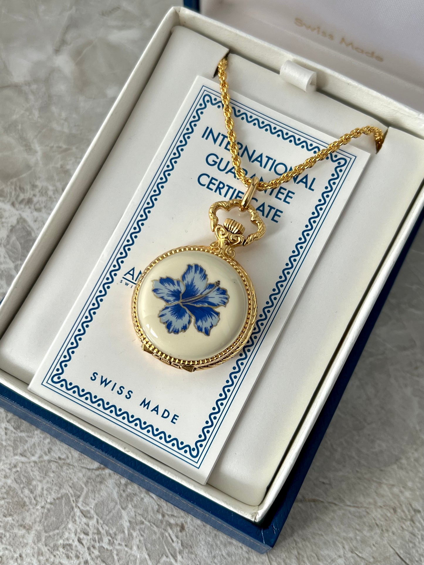 Andre Mouche Blue Floral Gold Tone Women’s Pendant Watch