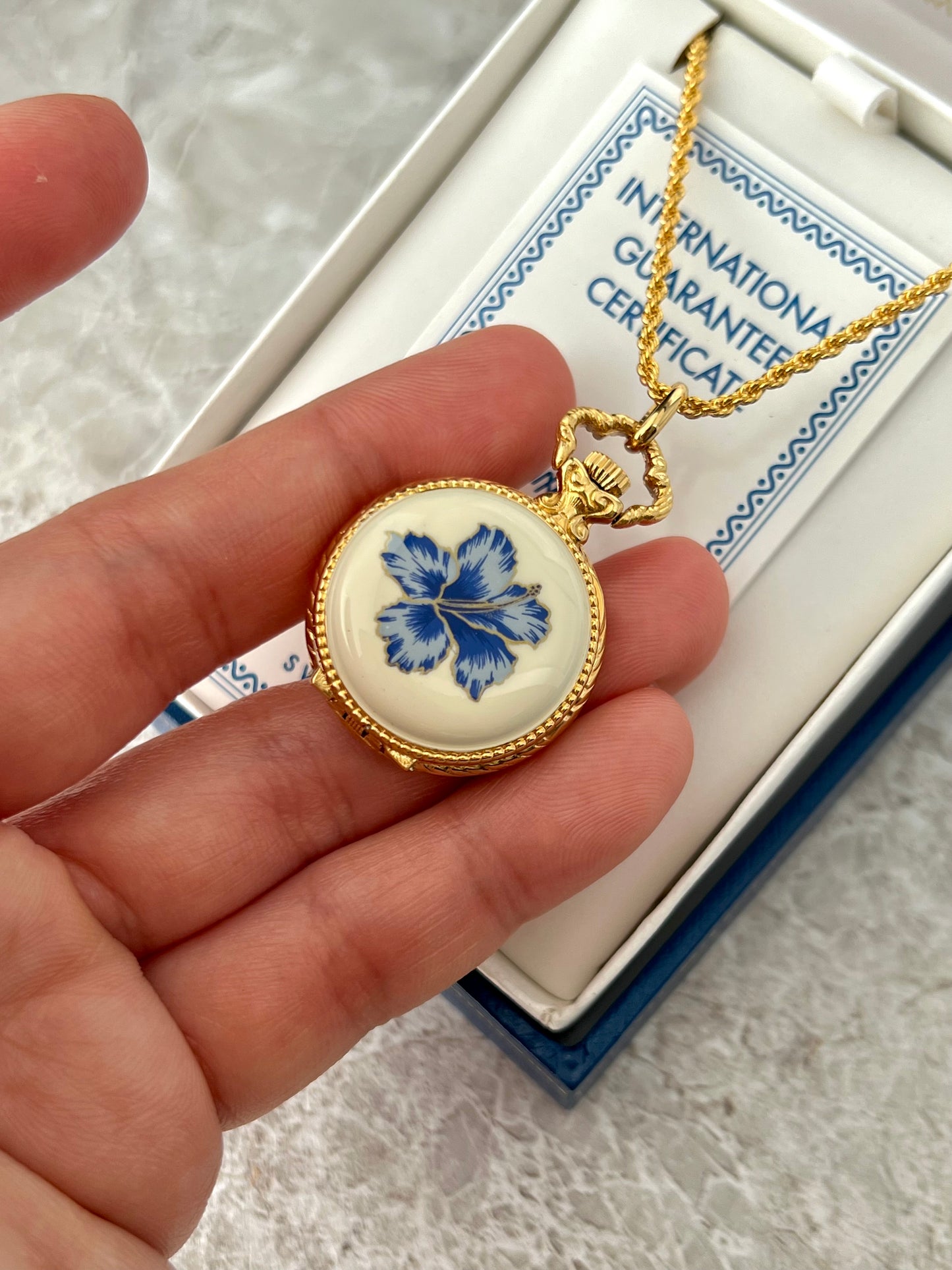 Andre Mouche Blue Floral Gold Tone Women’s Pendant Watch