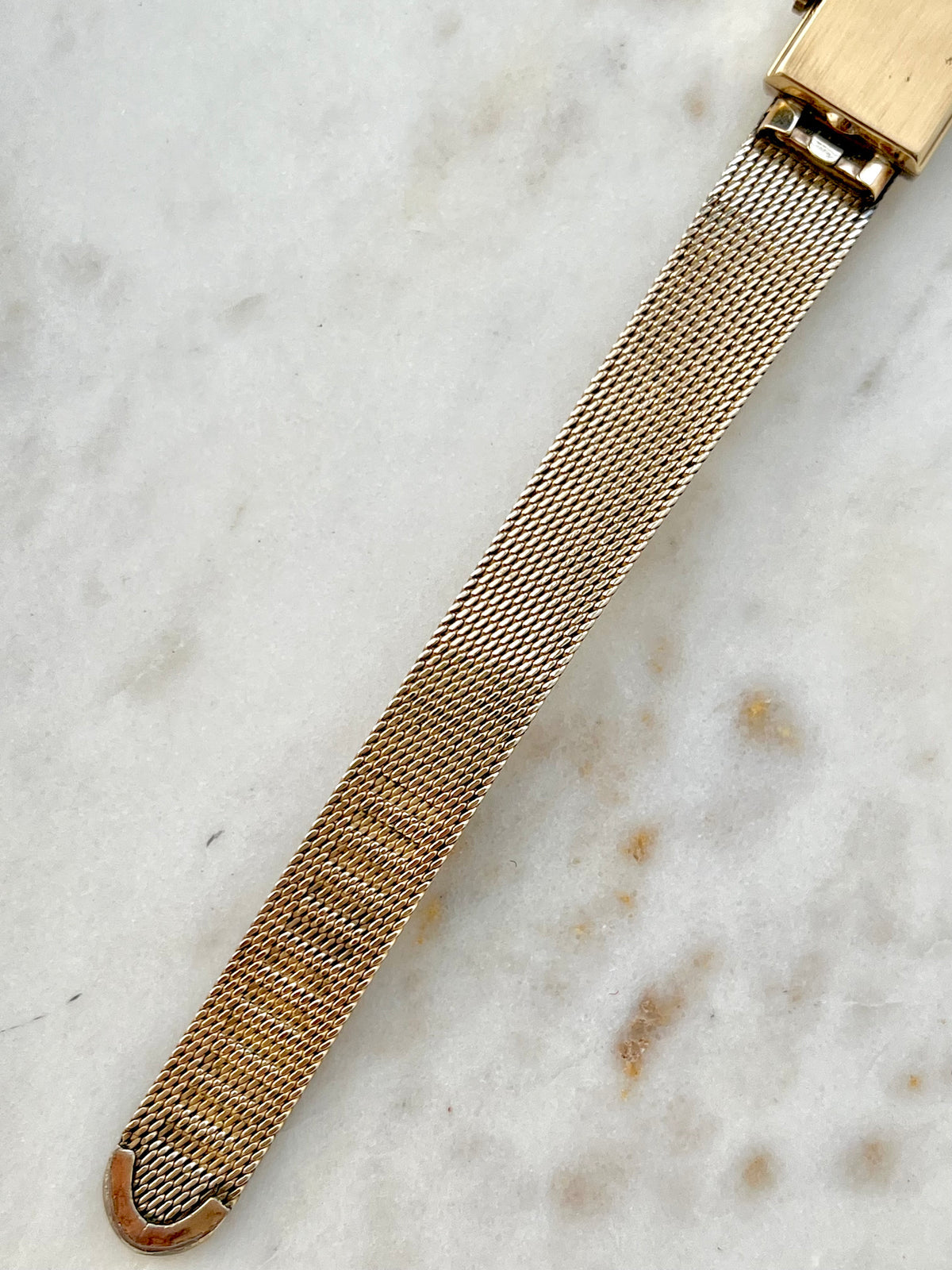 Omega Rectangular 14k Gold Filled Mesh Bracelet Watch, case profile of a vintage women's watch at Gilded Hour.
