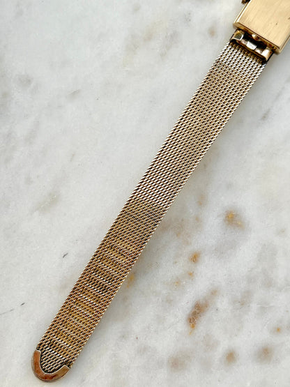 Omega Rectangular 14k Gold Filled Mesh Bracelet Watch, case profile of a vintage women's watch at Gilded Hour.