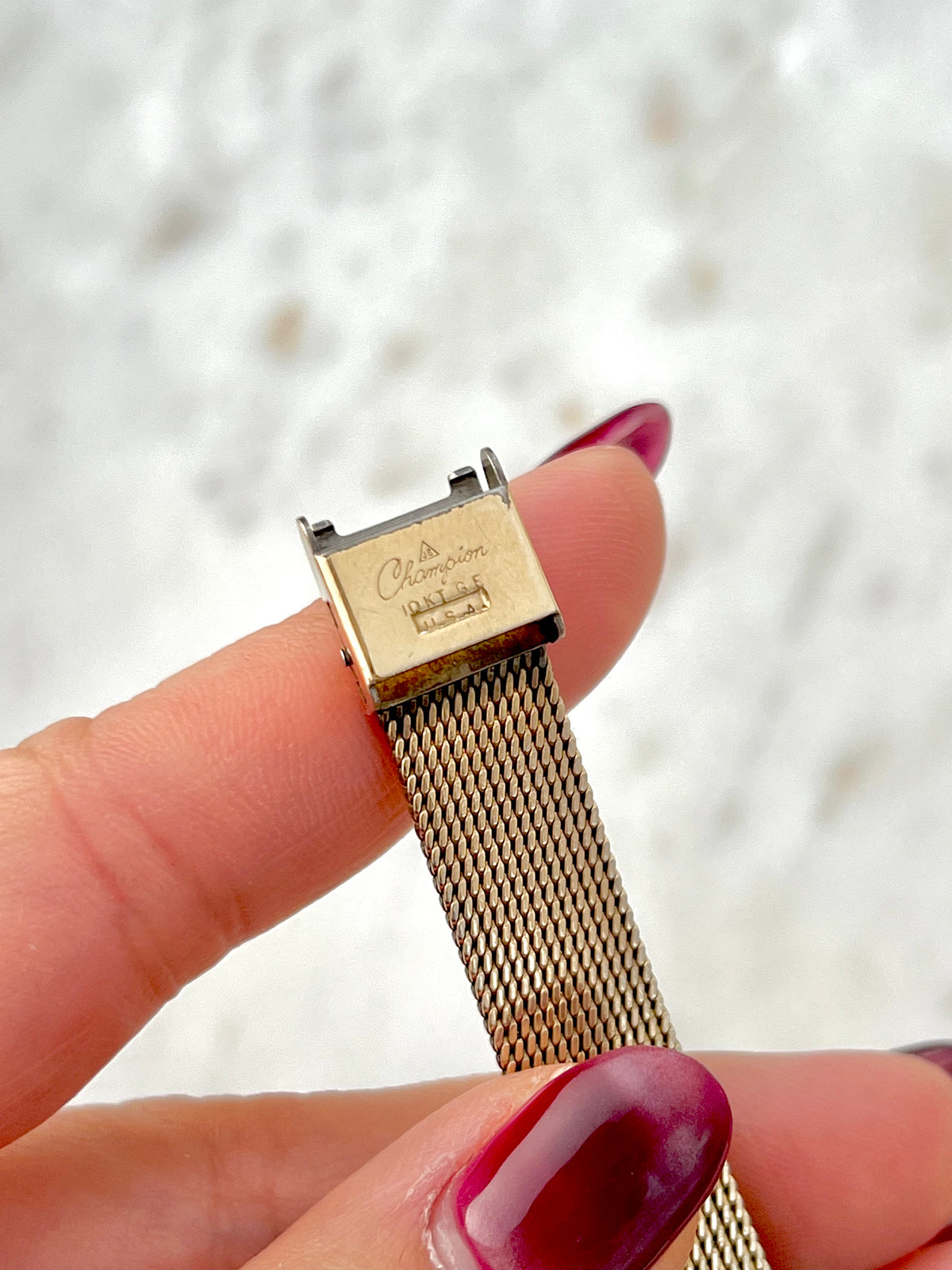 Omega Rectangular 14k Gold Filled Mesh Bracelet Watch, caseback detail of a vintage women's watch at Gilded Hour.
