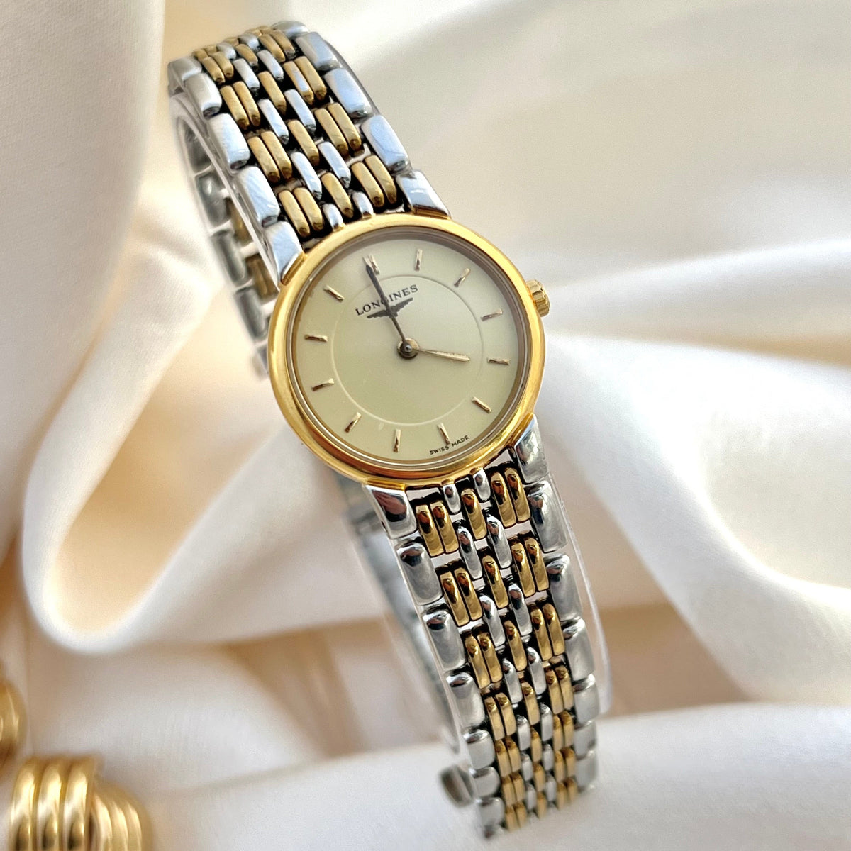 Longines Les Grandes Classique two-tone watch with gold and silver band on a white background