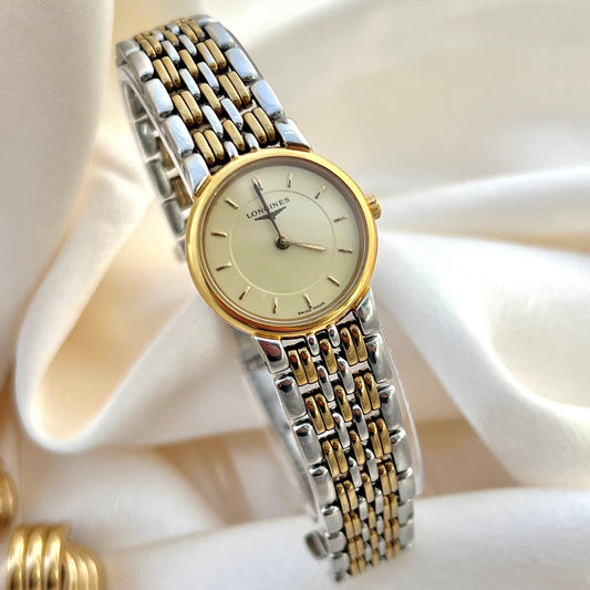 Longines Les Grandes Classique two-tone watch with gold and silver band on a white background