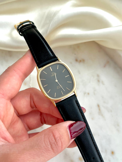 Omega De Ville Ellipse Anthracite Gold Tone Watch NZ Australia on a Marble Background