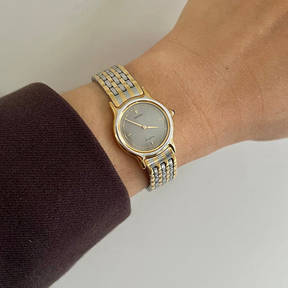 Seiko Exceline Gold Women's watch on a wrist with a neutral background