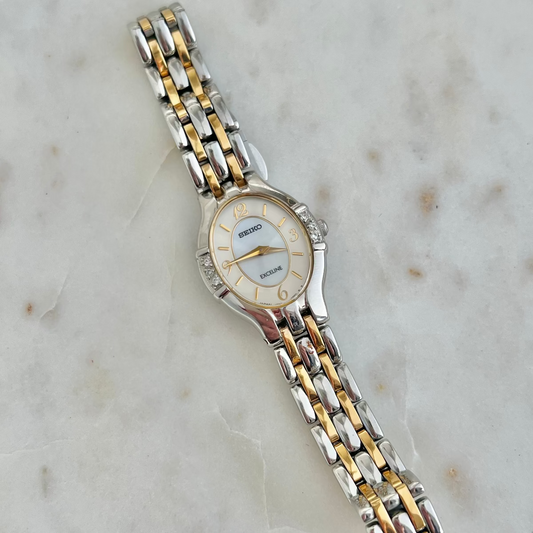 Seiko Exceline Silver and gold watch on a marble surface