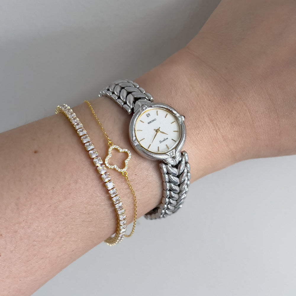 Close-up of the Seiko Exceline textured gold dial with raised indices