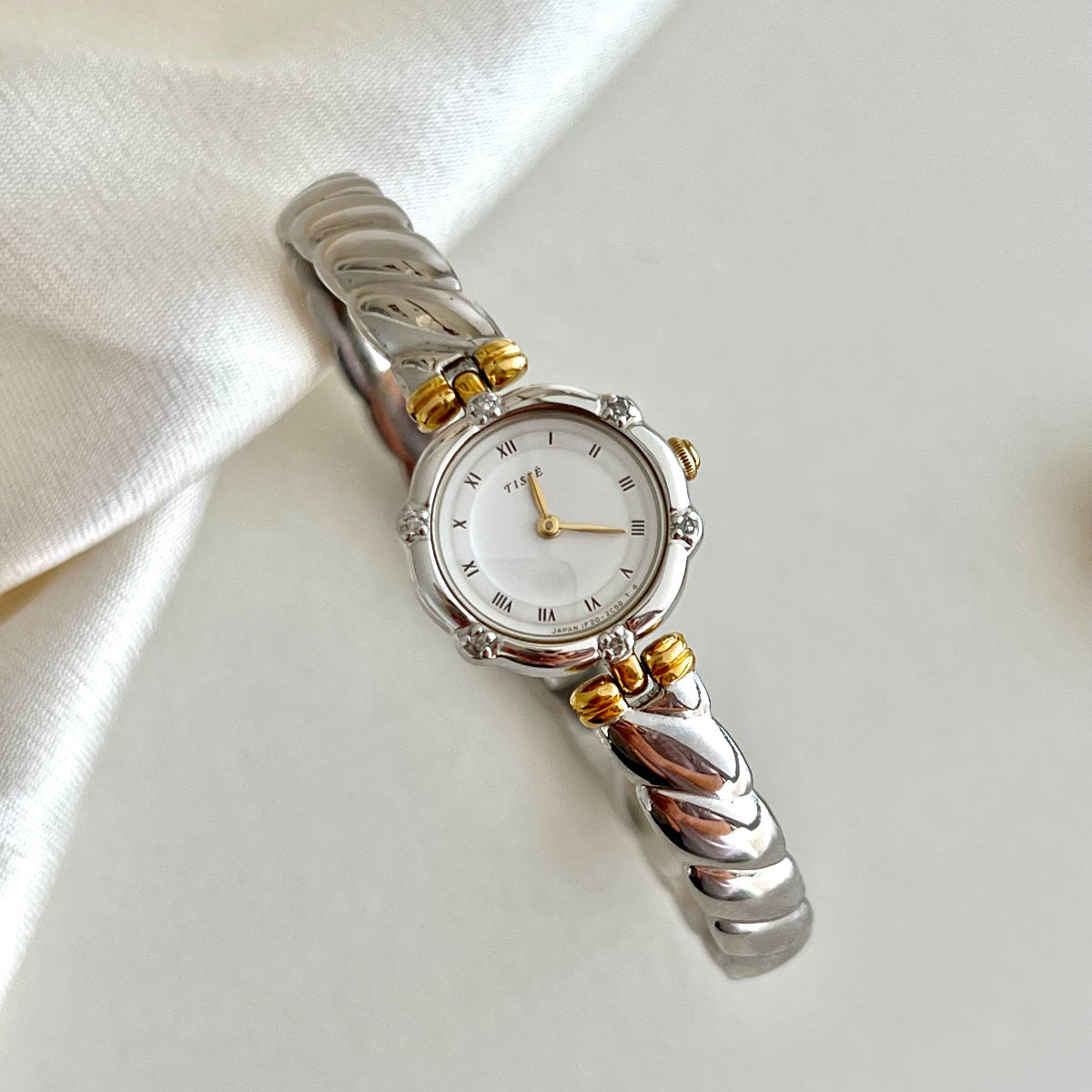 Seiko Tisse bangle watch in gold and silver with inlaid crystals