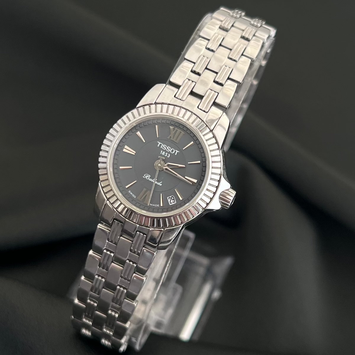 Silver Tissot Ballade women's watch on a black background