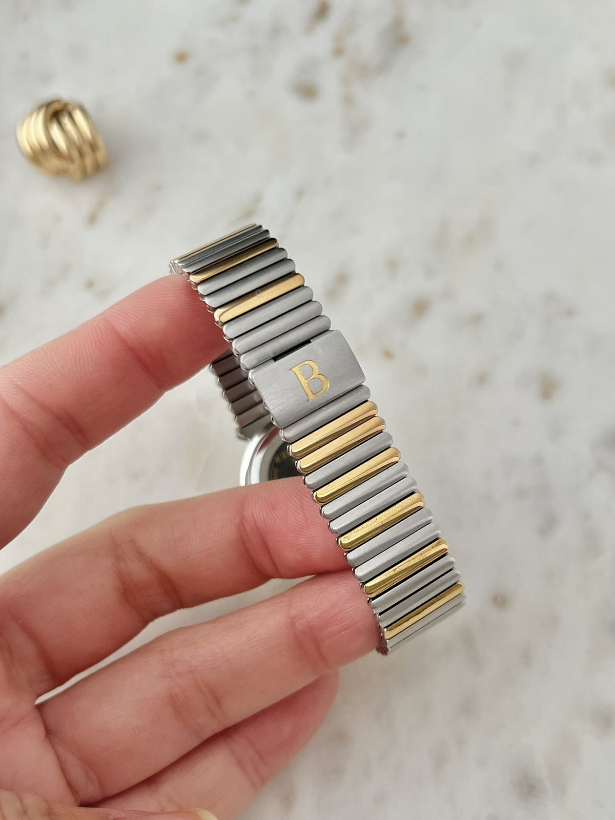Two tone expansion bracelet and Bucherer B clasp detail on reference 256.510 women’s watch