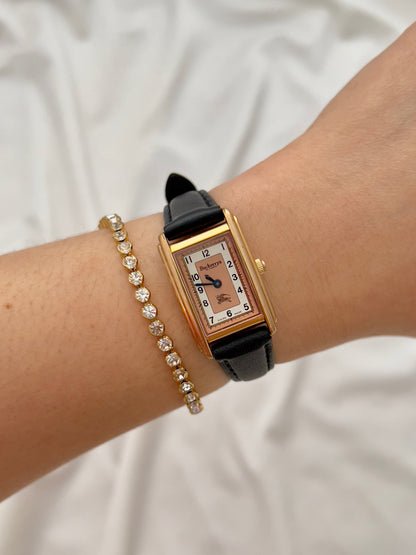Burberrys Salmon Dial Gold Tank Women’s Watch; black leather strap with burberrys buckle. Product photograph 3 of 15.