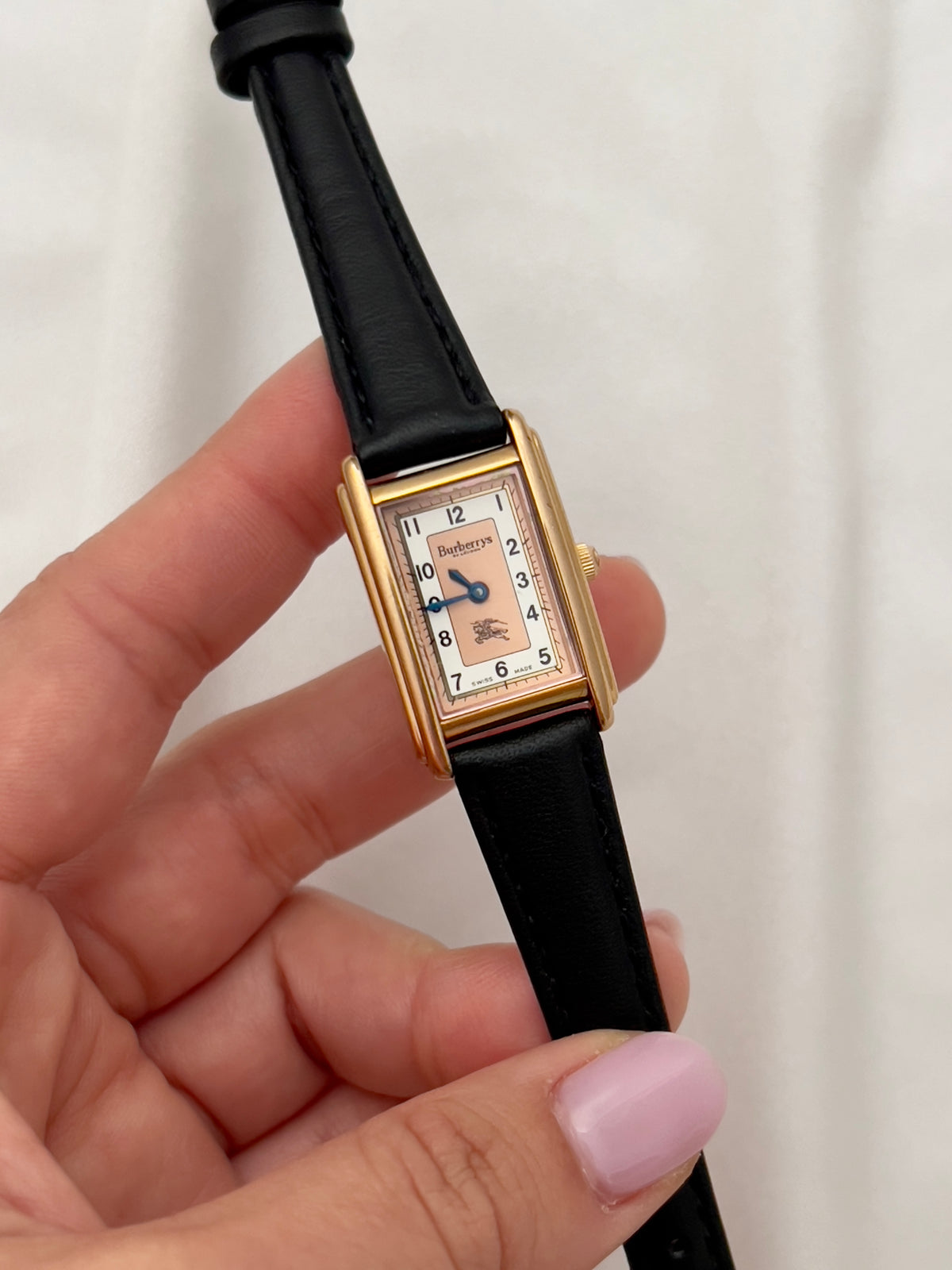 Burberrys Salmon Dial Gold Tank Women’s Watch; black leather strap with burberrys buckle. Product photograph 5 of 15.