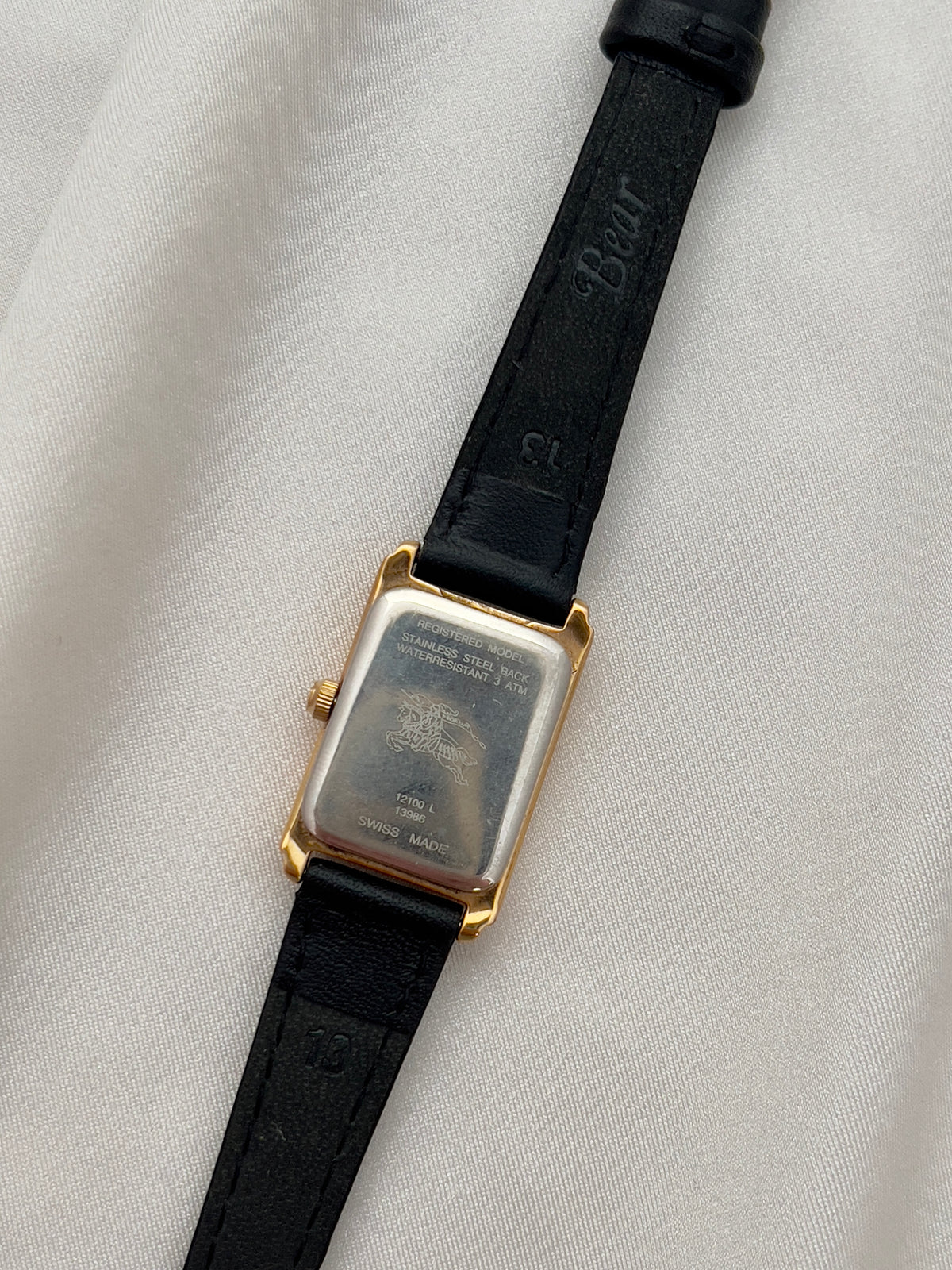 Burberrys Salmon Dial Gold Tank Women’s Watch; black leather strap with burberrys buckle. Product photograph 6 of 15.