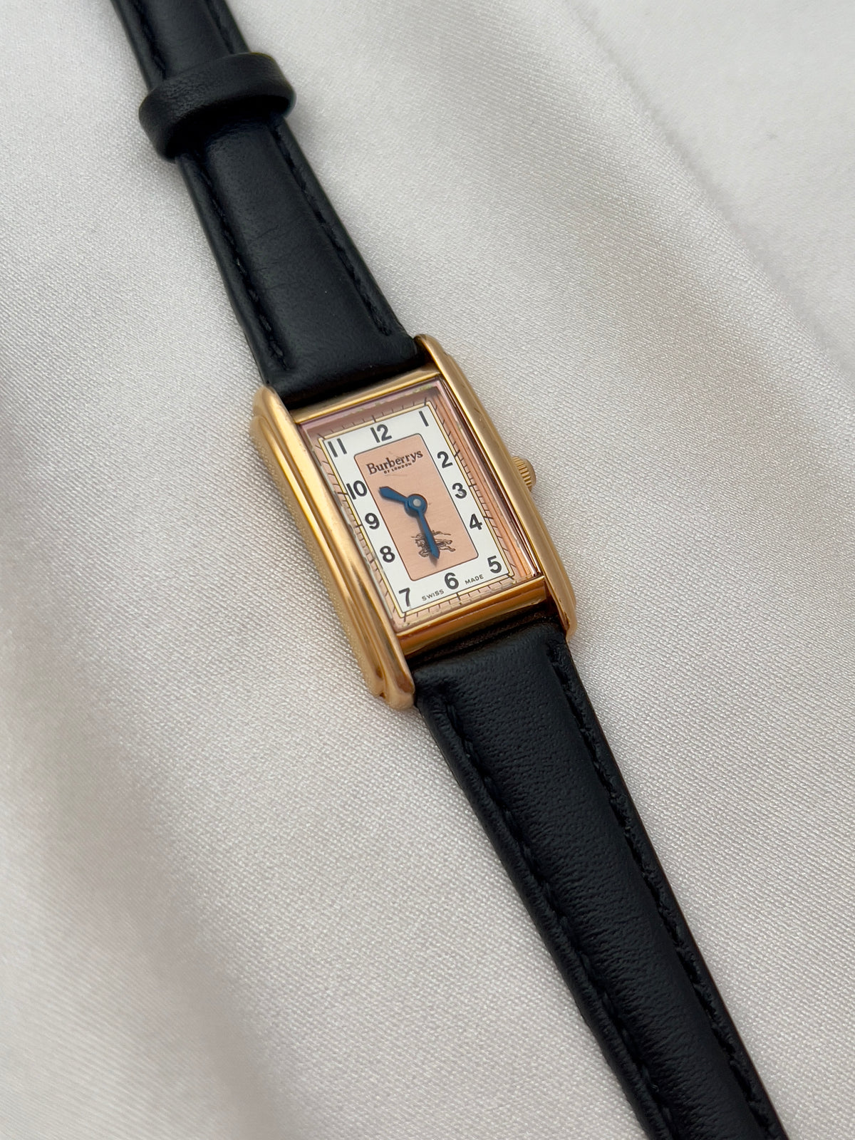 Burberrys Salmon Dial Gold Tank Women’s Watch; black leather strap with burberrys buckle. Product photograph 12 of 15.