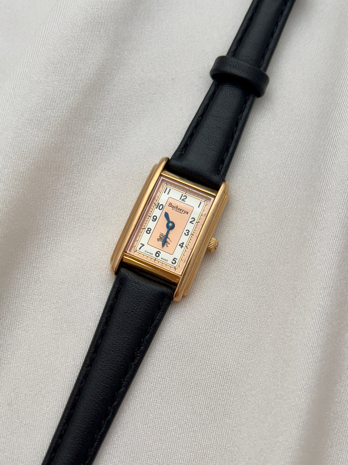 Burberrys Salmon Dial Gold Tank Women’s Watch; black leather strap with burberrys buckle. Product photograph 14 of 15.